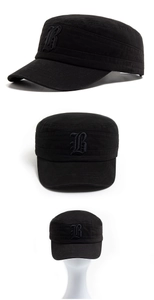 Close-up of black cotton military cap featuring Gothic B 3D embroidery and stitching