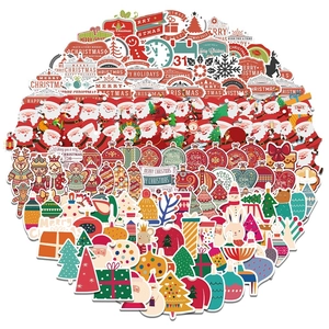 Detail of diverse Christmas stickers set featuring Santa, trees and reindeer on white background