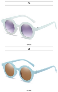 Side view of matte round frame sunglasses for kids in light green and blue finishes