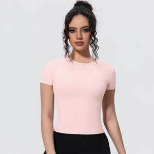 Close-up of slim fit pale pink yoga t-shirt featuring high-stretch breathable fabric