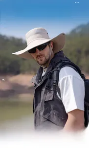 Detail of outdoor sun hat featuring wide brim, breathable mesh and windproof drawstring