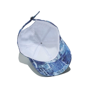 Detail of blue and white tie-dye denim baseball cap with adjustable metal back buckle