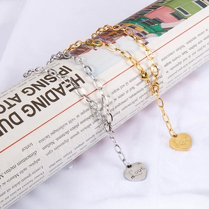 Minimalist stainless steel heart pendant necklaces in gold and silver finish with Love engraving