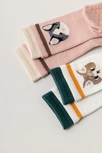 Detail of pink corgi and white fox cotton yoga socks with anti-slip grip and rib cuffs