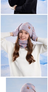 Detail of multi-color knit winter set including hat, scarf, and gloves with cozy fleece lining