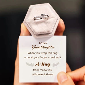 Detail of s925 silver cross ring with pavé crystals and elegant greeting gift card