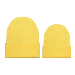 Matching yellow knit beanies for parent and child in a classic cuffed outdoor design