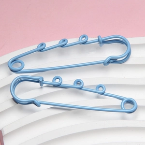 Detail of 6cm blue candy-colored safety pins with multi-ring design for DIY accessories