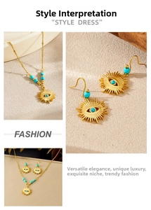 Detail of vintage gold-plated jewelry set with turquoise beads and evil eye pendants