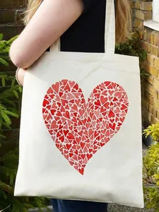 Off-white canvas tote bag featuring a large heart print carried by a model on shoulder