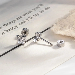 Silver hollow butterfly cartilage stud earrings with sparkling stones and screw back