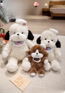 Three plush teddy puppies wearing chef hats and lace bibs in a warm home setting