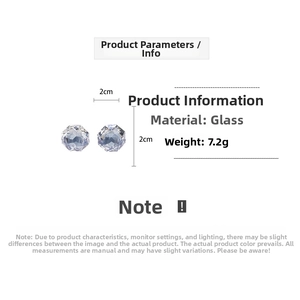 Detail view of light blue geometric faceted glass earrings with 20mm diameter size