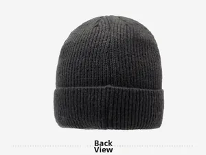 Detailed back view of a black knitted beanie with warm ribbed texture and folded cuff