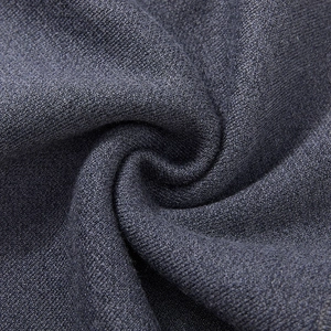 Detailed macro view of dark grey knit fabric texture for men's winter sweater vest