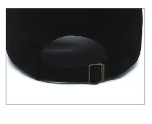 Detail of adjustable metal buckle on back of black cotton camouflage baseball cap