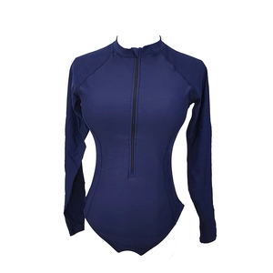 Detailed front view of navy blue long sleeve surf swimsuit with half-neck and zipper