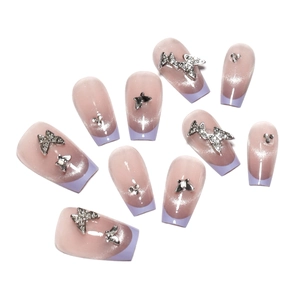 Purple cat-eye press-on nails with 3D silver butterflies and French tip design
