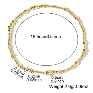 Three-piece gold beaded stretch bracelet set with varying bead sizes and dimensions