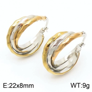 Detail view of tri-color twisted hoop earrings with textured finish and 22x8mm dimensions