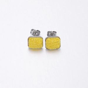 Square silver stud earrings featuring yellow crystal texture and butterfly backings