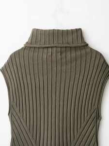 Close-up of olive green ribbed knit sleeveless sweater highlighting high-neck texture