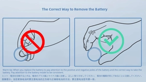 Guide showing the correct way to hold a button cell battery for the leaf alarm