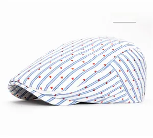 Detail view of blue and white striped ivy cap featuring cute red heart pattern embroidery