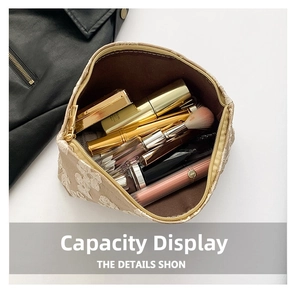Detail view of the large capacity beige lace makeup bag interior with cosmetics