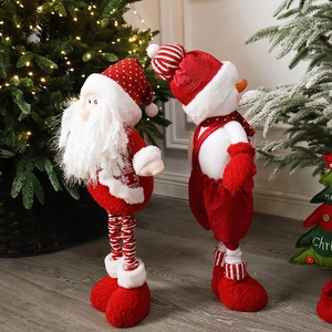 Standing telescopic Santa Claus and snowman plush dolls with festive Christmas tree background