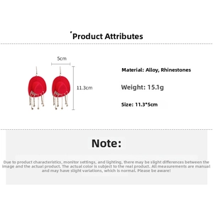 Detail view of red cowboy hat earrings with rhinestone fringe, size 11.3x5cm