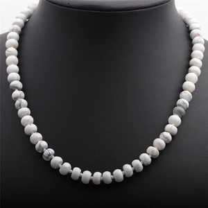 Handcrafted white marble stone necklace with abacus beads on a black display bust