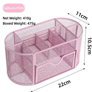 Detailed view of pink mesh desk organizer showing multiple compartments and small drawer