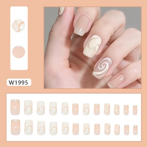 Cream French style press-on nails with fine glitter and spiral designs in 24 piece set