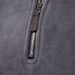 Men's half-zip polar fleece sweatshirt featuring a metal zipper and leather pull tab