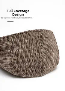 Detail of herringbone flat cap featuring full-back closure and reversible design
