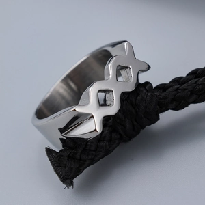 Minimalist silver stainless steel hollow X-pattern ring for men on black rope