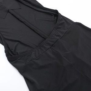 Detail of the backless design and elastic waist stitching on the black bodycon dress