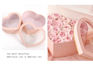 Pink heart-shaped gift box with transparent window and gold Rose lettering detail