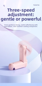 Detail showing the pink foldable mini fan with three-speed airflow adjustment button