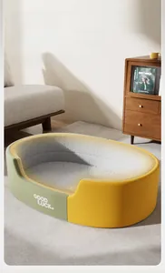 Detail of thickened oval dog bed with two-tone green and yellow design and cozy fleece texture