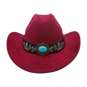 Detail of fuchsia jazz hat featuring a turquoise stone and ethnic floral embroidery