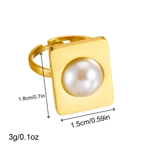 Gold plated stainless steel square ring with central pearl on a white background