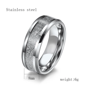 Detailed view of 8mm wide polished stainless steel ring with brushed texture center