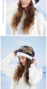 Detailed knit texture of the gradient winter hat featuring soft white plush fur trim
