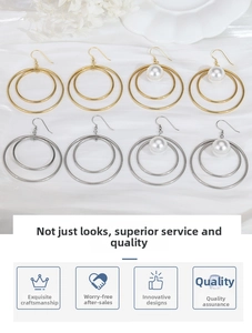 Detail of geometric double loop earrings in gold and silver finish with white pearls