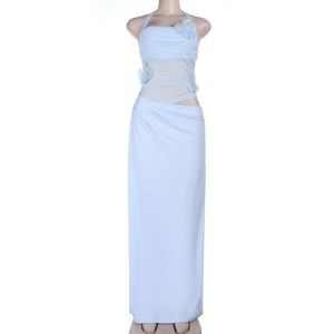 Detail of light blue evening dress featuring halter neck and hollow-out waist with flowers
