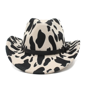 Detailed view of western cow print felt hat with black band and silver buckle
