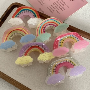Set of five cute rainbow and cloud acrylic hair claws for women in various pastel colors
