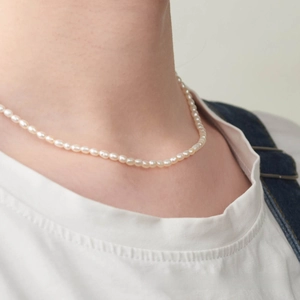 Detail of 3-4mm natural freshwater seed pearl necklace with S925 sterling silver hardware